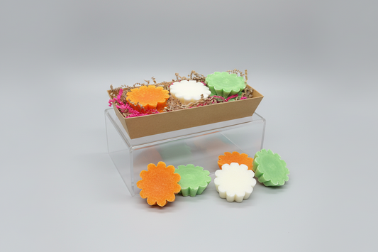 Hand-poured soy wax tarts in a clear clamshell package by What'cha Drink'n and More.